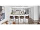 Kitchen featuring sleek counters and bar seating, seamlessly connected to the living area at 1625 Larimer St # 1806, Denver, CO 80202