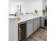 Modern kitchen with wine fridge, stainless appliances, and white countertops at 1625 Larimer St # 1806, Denver, CO 80202