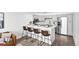 Modern kitchen with stainless steel appliances, sleek countertops, and a breakfast bar with seating at 1625 Larimer St # 1806, Denver, CO 80202