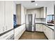 Modern kitchen features stainless steel appliances, sleek countertops, and ample storage at 1625 Larimer St # 1806, Denver, CO 80202