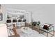 Bright and airy living room with modern decor, an open kitchen, and stylish seating arrangements at 1625 Larimer St # 1806, Denver, CO 80202