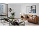 Bright living room with modern décor, comfortable seating, and cityscape view, creating a stylish urban retreat at 1625 Larimer St # 1806, Denver, CO 80202