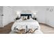 Cozy bedroom featuring two side tables, lamps, and geometric decorations at 1625 Larimer St # 1806, Denver, CO 80202