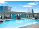 Rooftop pool surrounded by city views and comfortable lounge seating at 1625 Larimer St # 1806, Denver, CO 80202