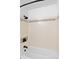 Bathroom shower featuring a white tiled wall design and sleek, modern fixtures at 1625 Larimer St # 1806, Denver, CO 80202