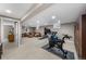 Spacious finished basement, exercise equipment, and comfortable living space at 5020 W Quarles Dr, Littleton, CO 80128