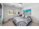 Comfortable bedroom with a white-painted wall and an art piece with a beach theme at 5020 W Quarles Dr, Littleton, CO 80128