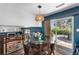 Cozy dining area with natural light and a view of the backyard patio at 5020 W Quarles Dr, Littleton, CO 80128