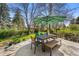 Outdoor patio area with a table, umbrella, and seating at 5020 W Quarles Dr, Littleton, CO 80128