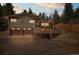 Charming home with a two-car garage, complemented by a retaining wall and manicured landscaping at 993 Fall River Rd, Idaho Springs, CO 80452