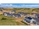 Expansive aerial view of a residential community with well-maintained homes and scenic surroundings at 3898 Descent St, Castle Rock, CO 80108