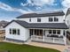 Exterior of home featuring a covered patio with furniture, solar panels and a well manicured yard at 3898 Descent St, Castle Rock, CO 80108