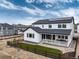 Stunning back exterior featuring a covered patio, solar panels, and well-manicured backyard at 3898 Descent St, Castle Rock, CO 80108