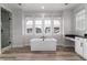 Bright bathroom features a soaking tub, double windows, and contemporary fixtures at 3898 Descent St, Castle Rock, CO 80108