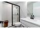 Elegant bathroom showcasing a sleek glass-enclosed shower and modern fixtures at 3898 Descent St, Castle Rock, CO 80108