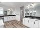 Spacious bathroom featuring dual vanities, sleek countertops, and modern lighting at 3898 Descent St, Castle Rock, CO 80108