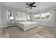 Bright bedroom features wood floors, neutral tones, and side tables with matching lamps at 3898 Descent St, Castle Rock, CO 80108