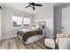 Inviting bedroom features neutral tones and natural light from the double windows at 3898 Descent St, Castle Rock, CO 80108