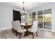 Bright dining room with stylish chairs and a sliding door offering outdoor views at 3898 Descent St, Castle Rock, CO 80108
