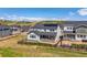 Two-story home featuring a fenced yard with a covered patio, and solar panels on the roof at 3898 Descent St, Castle Rock, CO 80108
