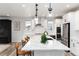 Bright kitchen with a center island, stainless steel appliances, and modern finishes and fixtures at 3898 Descent St, Castle Rock, CO 80108