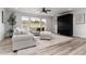 Cozy living room featuring plush sofas, a large rug, and a dark cabinet at 3898 Descent St, Castle Rock, CO 80108