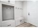 Well-organized mudroom with built-in storage, hooks, and a convenient bench at 3898 Descent St, Castle Rock, CO 80108