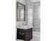 Bathroom featuring grey marble tile, a modern sink, and shower with glass door at 424 N Clarkson St, Denver, CO 80218