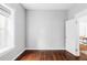 Bright bedroom with hardwood floors, white walls, and natural light at 424 N Clarkson St, Denver, CO 80218