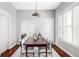 Dining room with a large table, seating for eight, and natural light from the window at 424 N Clarkson St, Denver, CO 80218