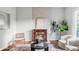 Stylish living room with a fireplace, hardwood floors, and neutral decor at 424 N Clarkson St, Denver, CO 80218