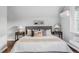 Cozy primary bedroom featuring a comfortable bed, stylish decor, and an air conditioning unit at 424 N Clarkson St, Denver, CO 80218
