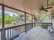Enjoy outdoor living on this covered wood deck with a ceiling fan at 6160 Taft Ct, Arvada, CO 80004