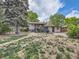 This backyard has a patio, deck, storage shed, and mature landscaping at 6160 Taft Ct, Arvada, CO 80004