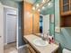 Bathroom with a spacious vanity, offering plenty of counter space and storage options at 6160 Taft Ct, Arvada, CO 80004