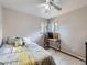 Bright bedroom with a desk area near the window, creating a functional and inviting space at 6160 Taft Ct, Arvada, CO 80004