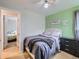 Bedroom featuring calming green accents and a cozy bed, creating a relaxing atmosphere at 6160 Taft Ct, Arvada, CO 80004