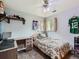 This bedroom includes a ceiling fan, closet, and natural light from the dual windows at 6160 Taft Ct, Arvada, CO 80004