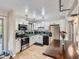 Well-lit kitchen with white cabinets, stainless steel appliances, and dark countertops at 6160 Taft Ct, Arvada, CO 80004