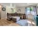 Comfortable living room with hardwood floors, large window and a plush sectional sofa with ottoman at 6160 Taft Ct, Arvada, CO 80004