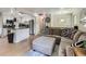Spacious open floor plan showing kitchen and living room with hardwood floors and open concept at 6160 Taft Ct, Arvada, CO 80004