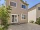 Backyard showcasing a patio, sliding glass door, and low-maintenance landscaping at 2216 S Nile Ct, Aurora, CO 80014