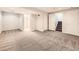 Finished basement area with neutral carpet, doors, and access to the upper floors at 2216 S Nile Ct, Aurora, CO 80014