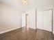 Charming bedroom featuring plank floors, overhead lighting, ample closet space, and inviting ambiance at 2216 S Nile Ct, Aurora, CO 80014