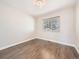 Bright bedroom with plank flooring, natural light, and neutral paint, perfect for relaxation at 2216 S Nile Ct, Aurora, CO 80014