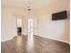 Inviting bedroom with en suite bath, walk-in closet, ceiling fan, and plank floors at 2216 S Nile Ct, Aurora, CO 80014