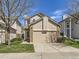 Charming two-story home with a well-maintained lawn, a two-car garage, and an attractive brick and siding facade at 2216 S Nile Ct, Aurora, CO 80014