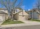 Charming two-story home with a well-maintained lawn, a two-car garage, and an attractive brick and siding facade at 2216 S Nile Ct, Aurora, CO 80014