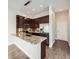 Modern kitchen with stainless steel appliances, granite countertops, and stylish cabinetry. Includes eating space at 2216 S Nile Ct, Aurora, CO 80014