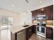 Well-equipped kitchen with granite countertops, stainless steel appliances, and modern fixtures and eating space at 2216 S Nile Ct, Aurora, CO 80014